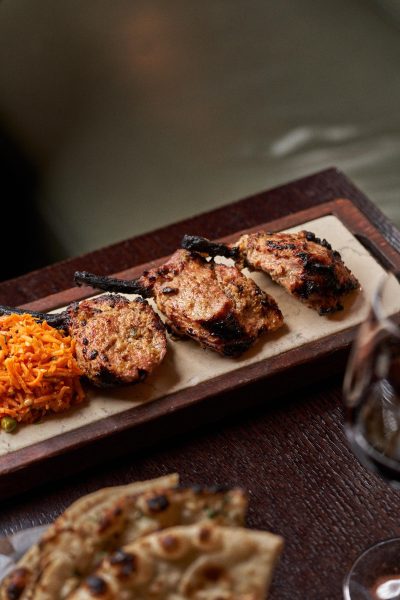 Valentine’s romantic candle lit dining menu at Jamavar Restaurant Berkeley Square Mayfair celebrations, candlelight flickers across the dining room.