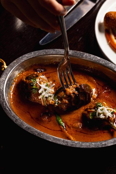 Valentine’s romantic candle lit dining menu at Jamavar Restaurant Berkeley Square Mayfair celebrations, candlelight flickers across the dining room.